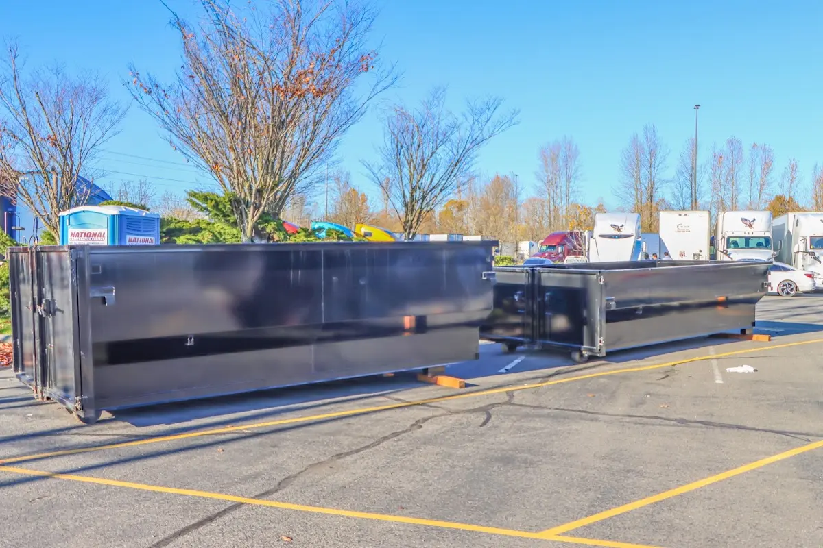 Professional dumpster rental service with roll-off container on residential driveway in Gulf Gate